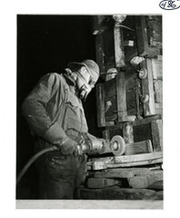 Man using a grinding wheel