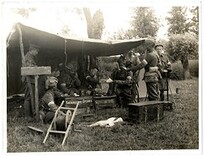 Brigade Signal Section [Dehra Dun Brigade]. Headquarter Section at work in the field [St Floris, France]. Photographer: H. D. Girdwood.