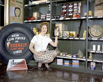 Employee displaying Fruehauf Fleet Miler products, Calgary, Alberta