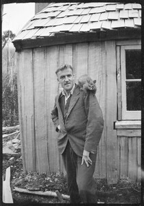 Jack with Fergy's tame possum, Betty. (c1940)