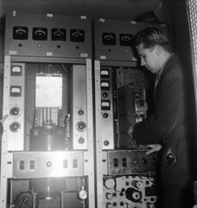 Television transmitter is being installed into the Helsinki Olympic stadium tower, 22.1.1957