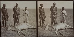 Three young men stand over an antelope carcass on a study trip in Makamba in June 1909.
