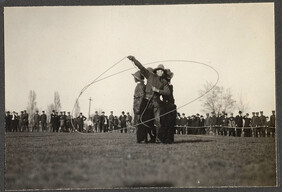 Soldiers from Western Canada as cowboys, demonstrating roping
