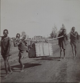 On the road to Nairobi. Brickhouse, Gallen-Kallela familyâ€™s home abroad, on the background. ; Photograph 2.
